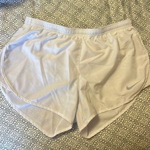 NIKE Dri-fit shorts in white.